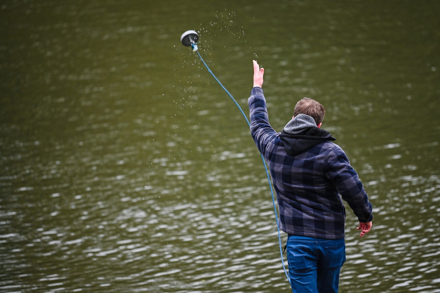 man goes magnet fishing