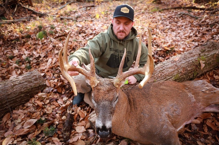 photo of hunter with whitetail buck