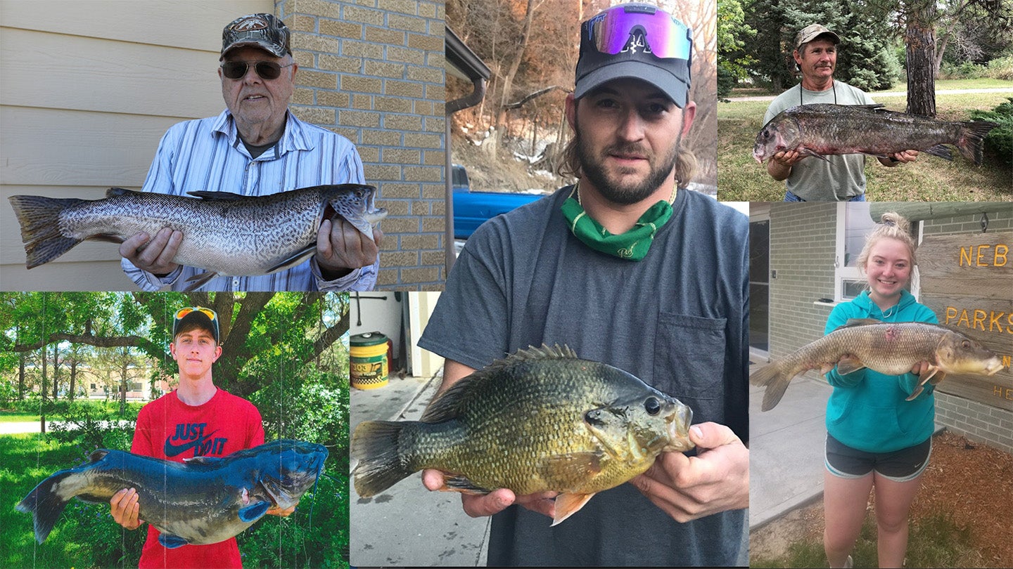 Some proud Nebraskans pose with their record-setting fish. 