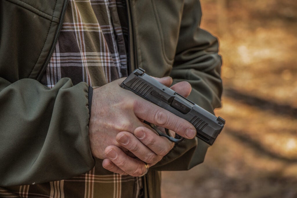 photo of handgun and shooter