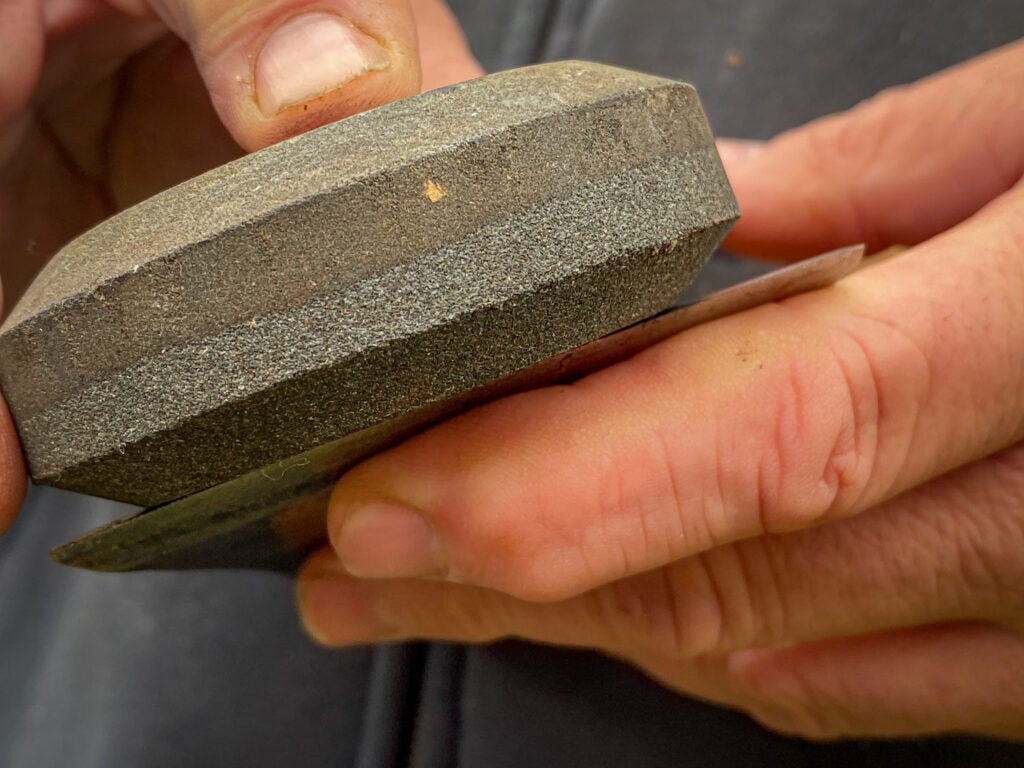 Sharpening an axe with a sharpening puck