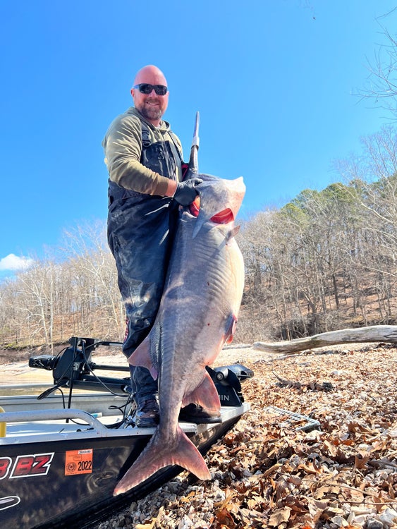 Guide Rusty Pritchard with a 100-pound spoonbill. 