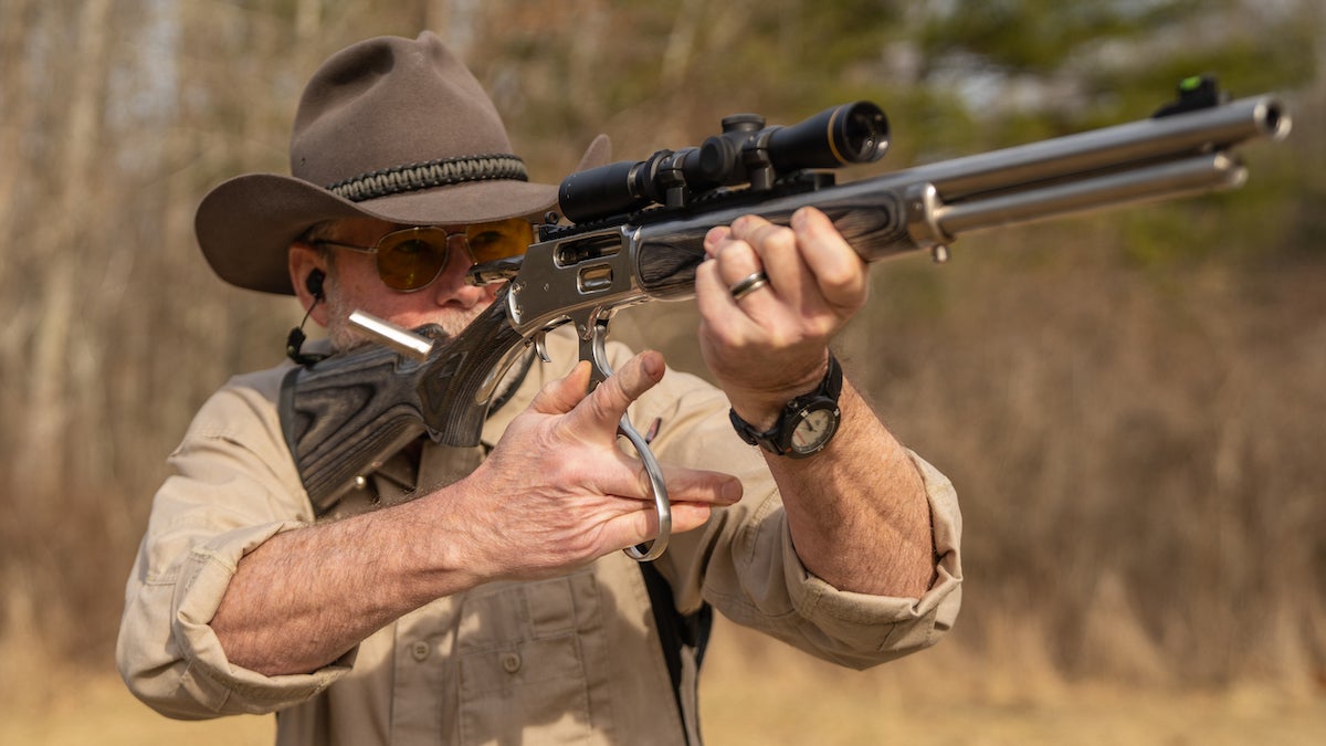 Man shooting a Marlin 1895 lever action rifle.