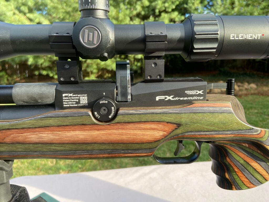 The left of the FX Dreamline air rifle, showcasing the GRS laminate and pressure setting