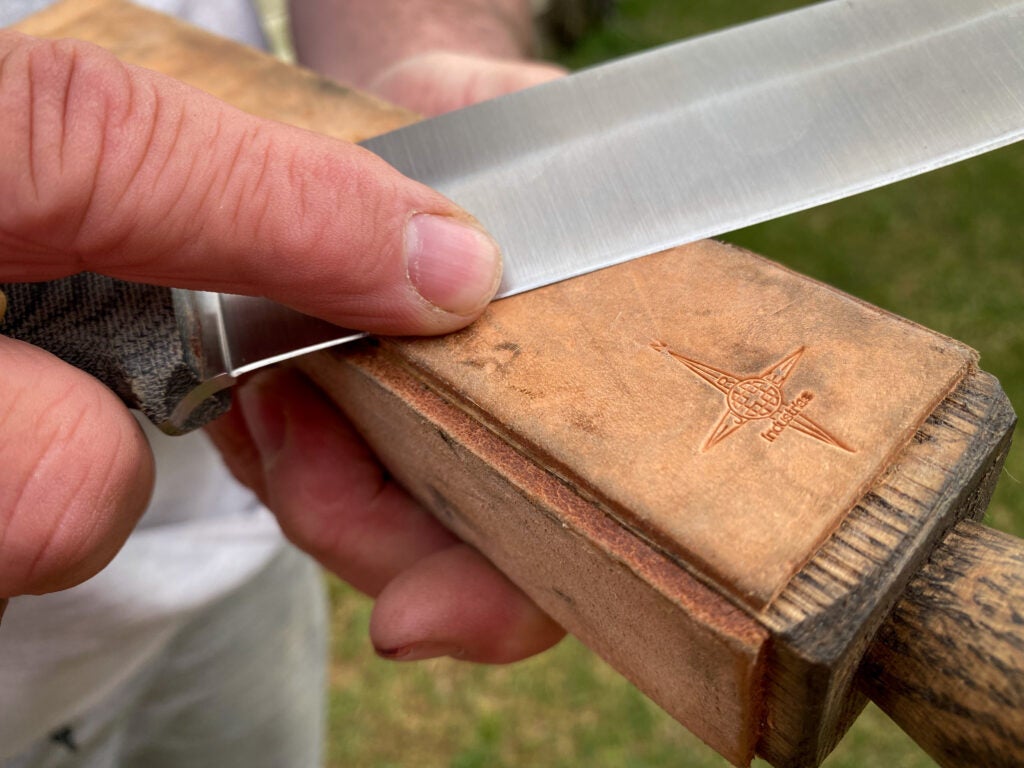 Finishing a sharpened knife with a leather strop