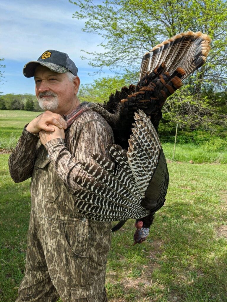 photo of hunter with turkey