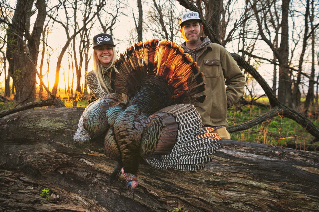 photo of hunters with turkey