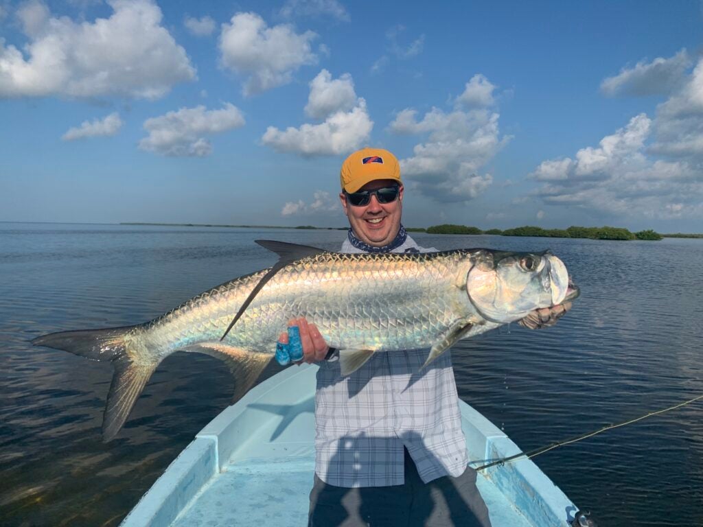 fly fisherman with a tarpon