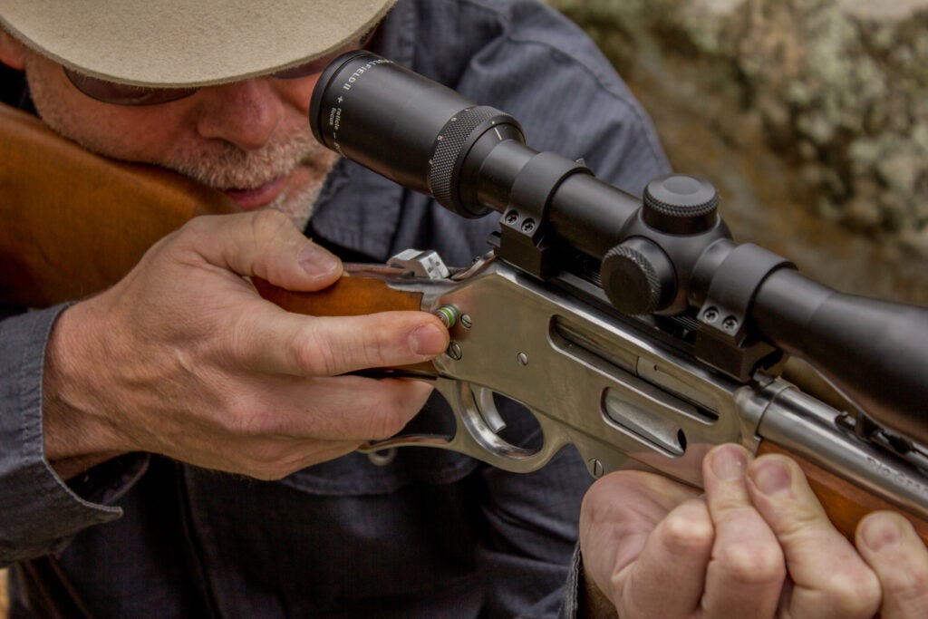photo of hunter shooting a lever-action rifle