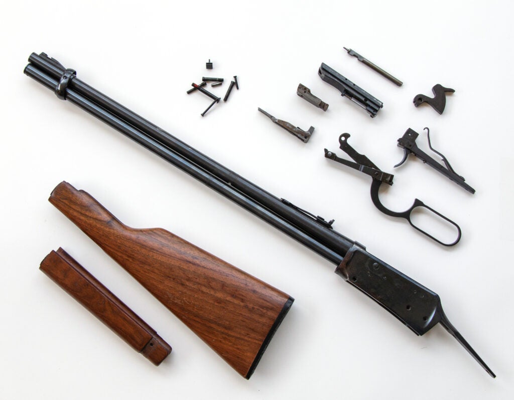 photo of disassembled lever-action rifle