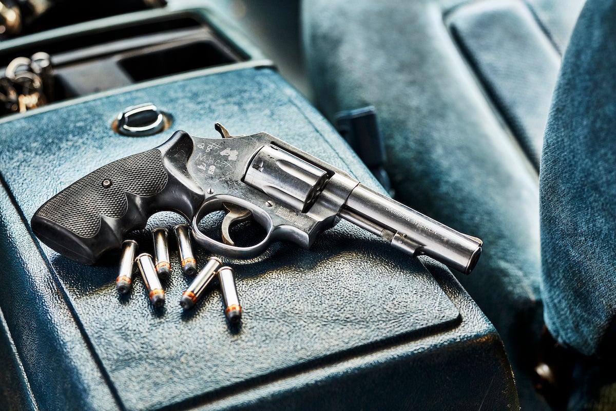 Revolver on the center console of a truck.