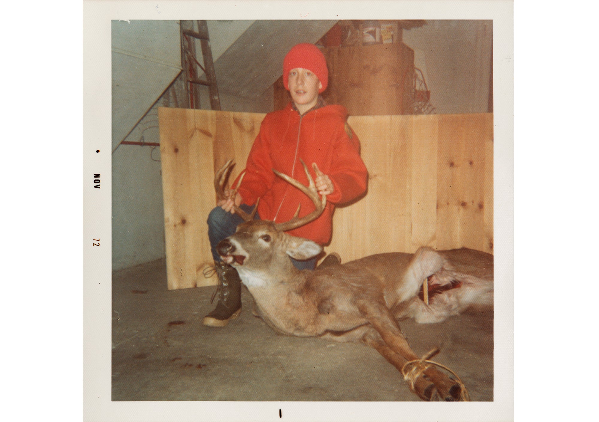 Young Bestul holds up buck's antlers
