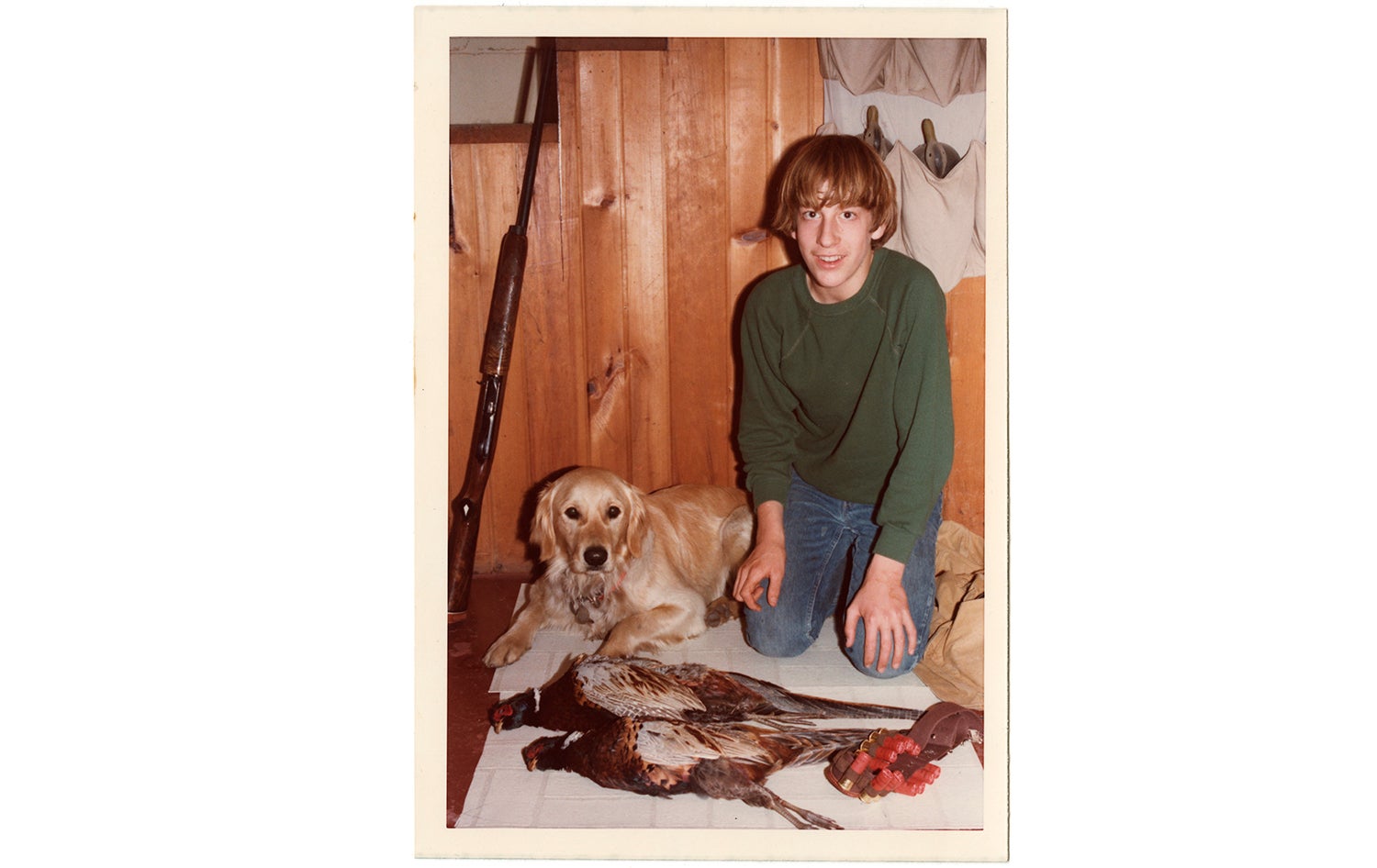 Young Scott Bestul with dog and pheasants