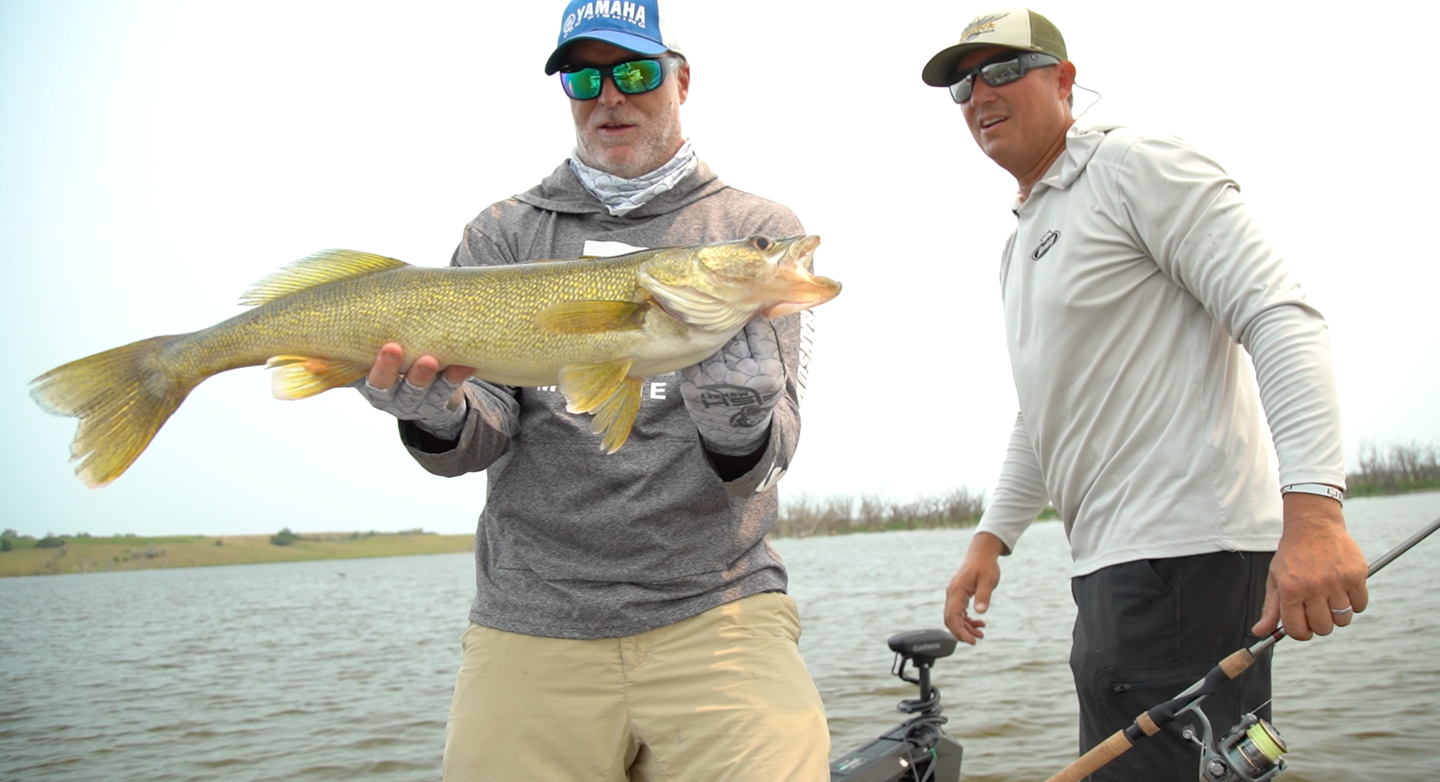 The author, left, with an opening day Minnesota walleye. 