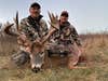 photo of hunter and whitetail buck