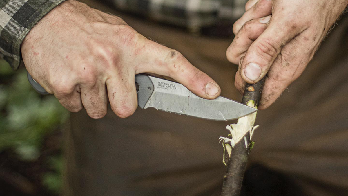 Using Gerber Fixed Blade Knife to strip bark