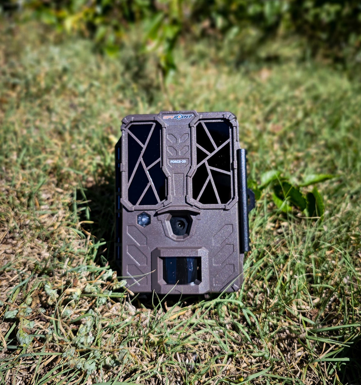 SpyPoint Force-20 trail camera sitting on grass