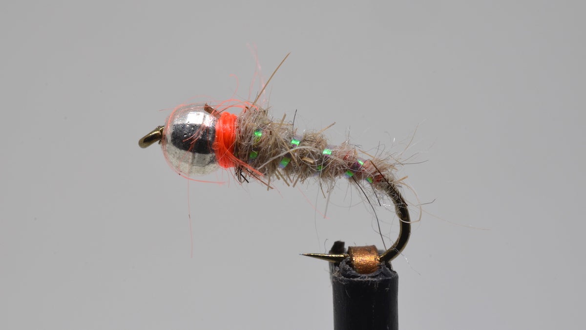 The Sexy Waltz fly fishing pattern on a gray background.