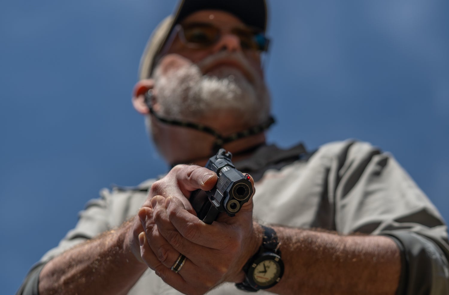 Shooter holding a handgun.