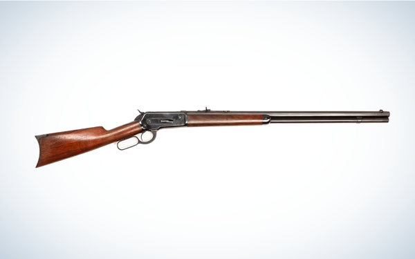 Winchester Model 1886 Lever Action Rifle on gray and white background