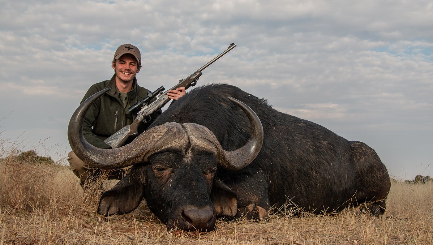 photo of hunter with Cape buffalo