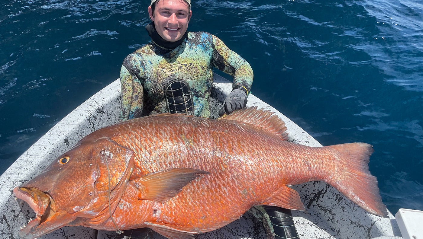 photo of angler with cubera snapper