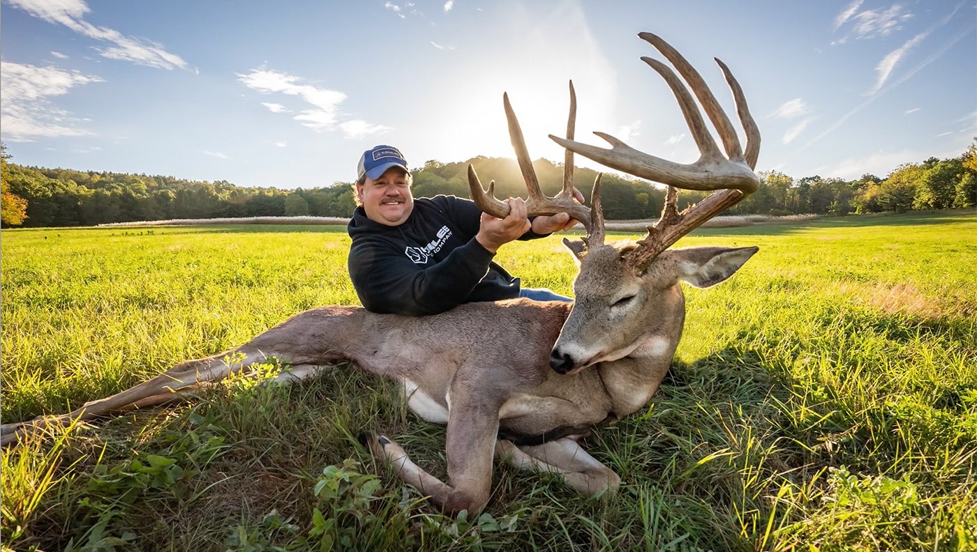 photo of hunter with trophy whitetail buck