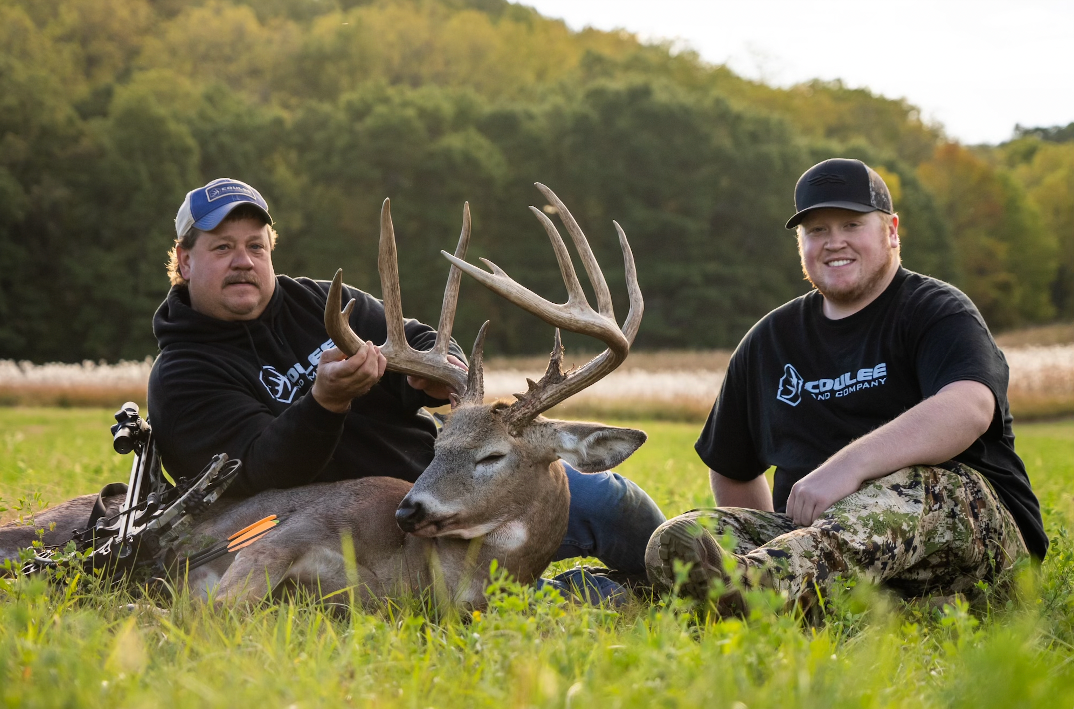 photo of hunters with trophy buck