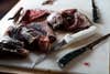 Field & Stream's four best boning knives around processed deer meat.