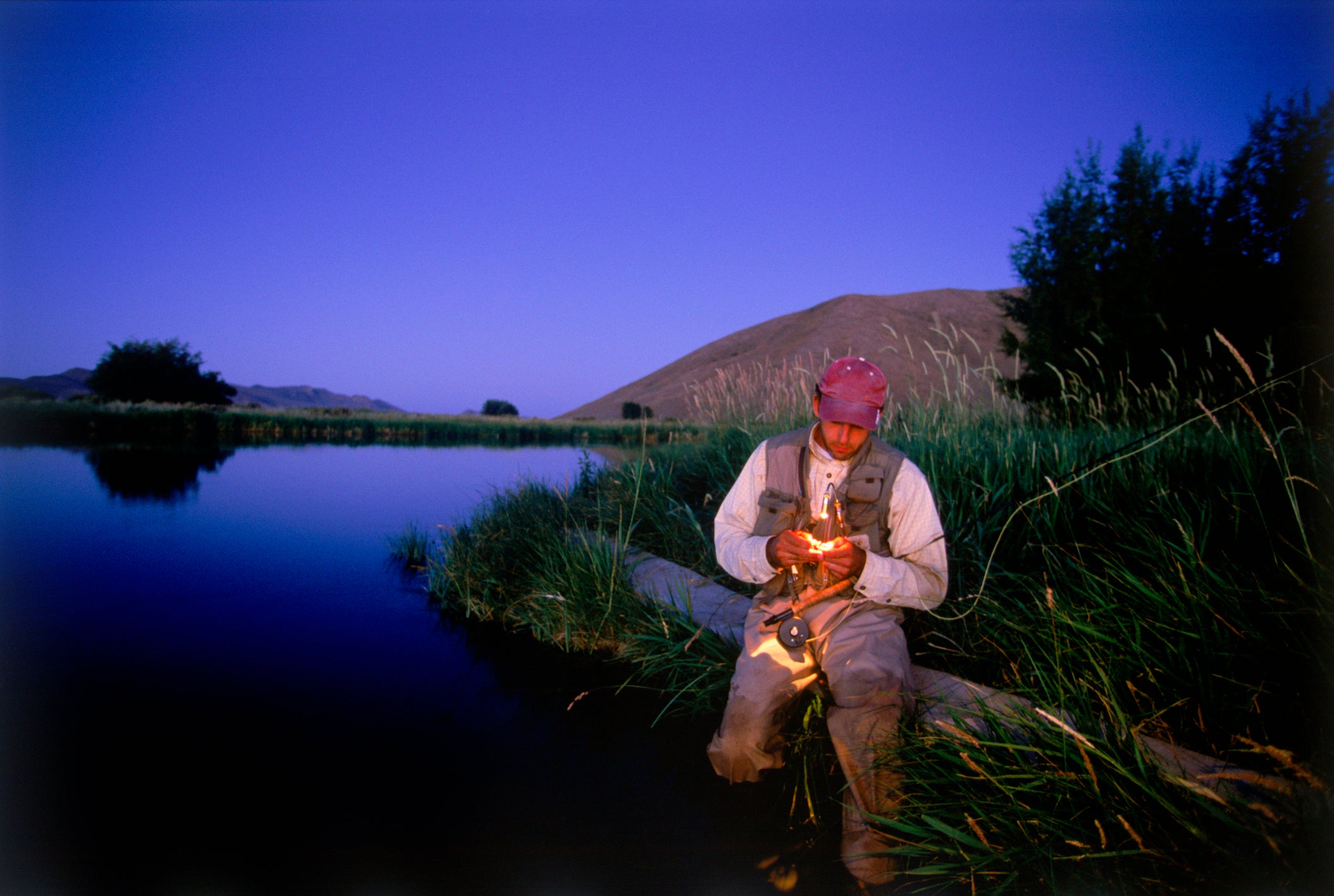 Man trout fishing at night, Idaho