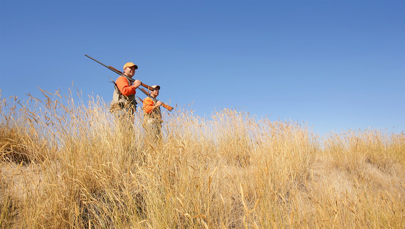photo of hunters in grassland habitat