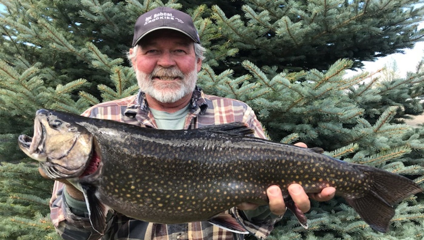 photo of angler with record brook trout