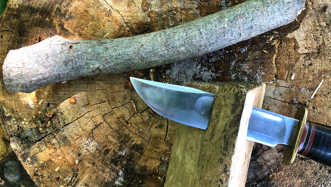 photo of knife in wood