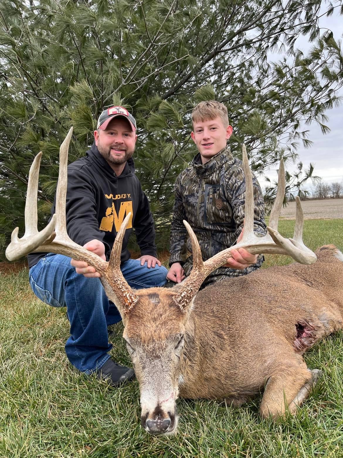 photo of hunters with whtietail buck