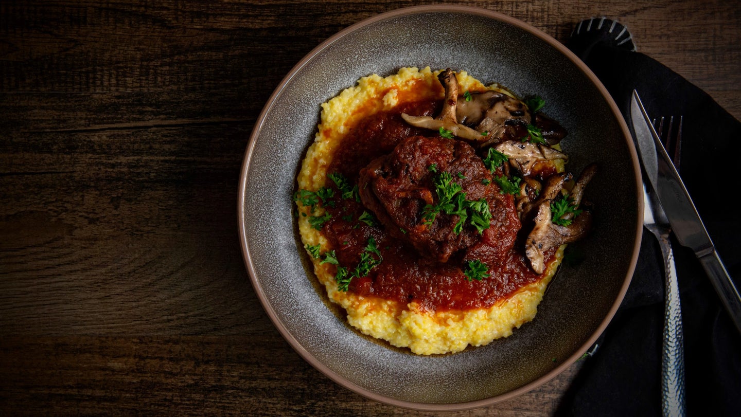 Plate of osso buco with polenta.