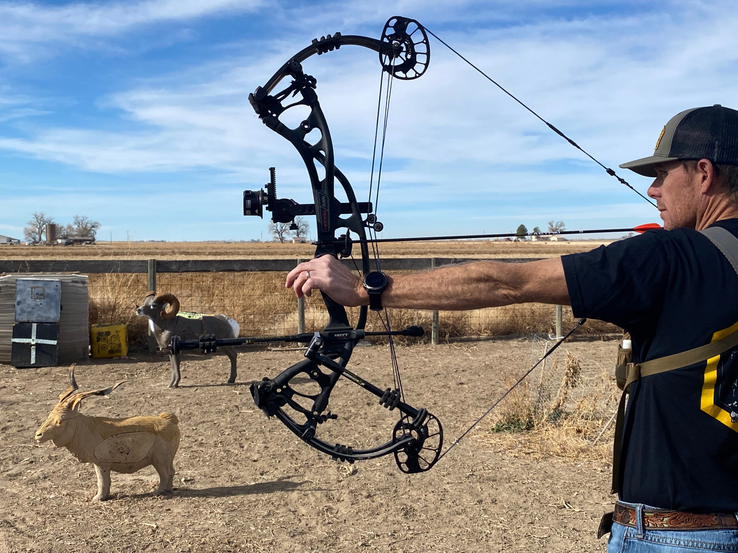 archer shooting compound bow