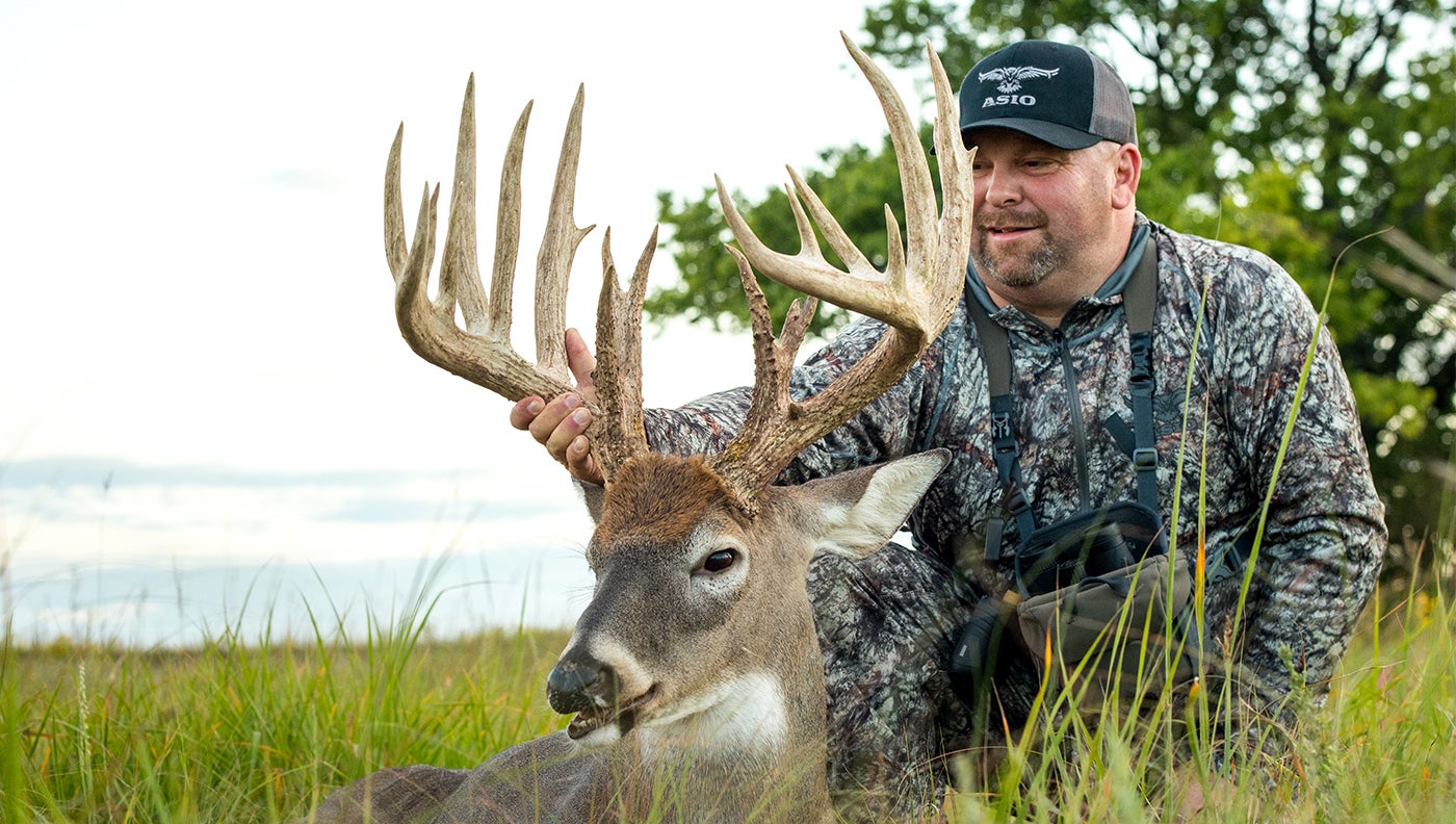 photo of hunter with big buck