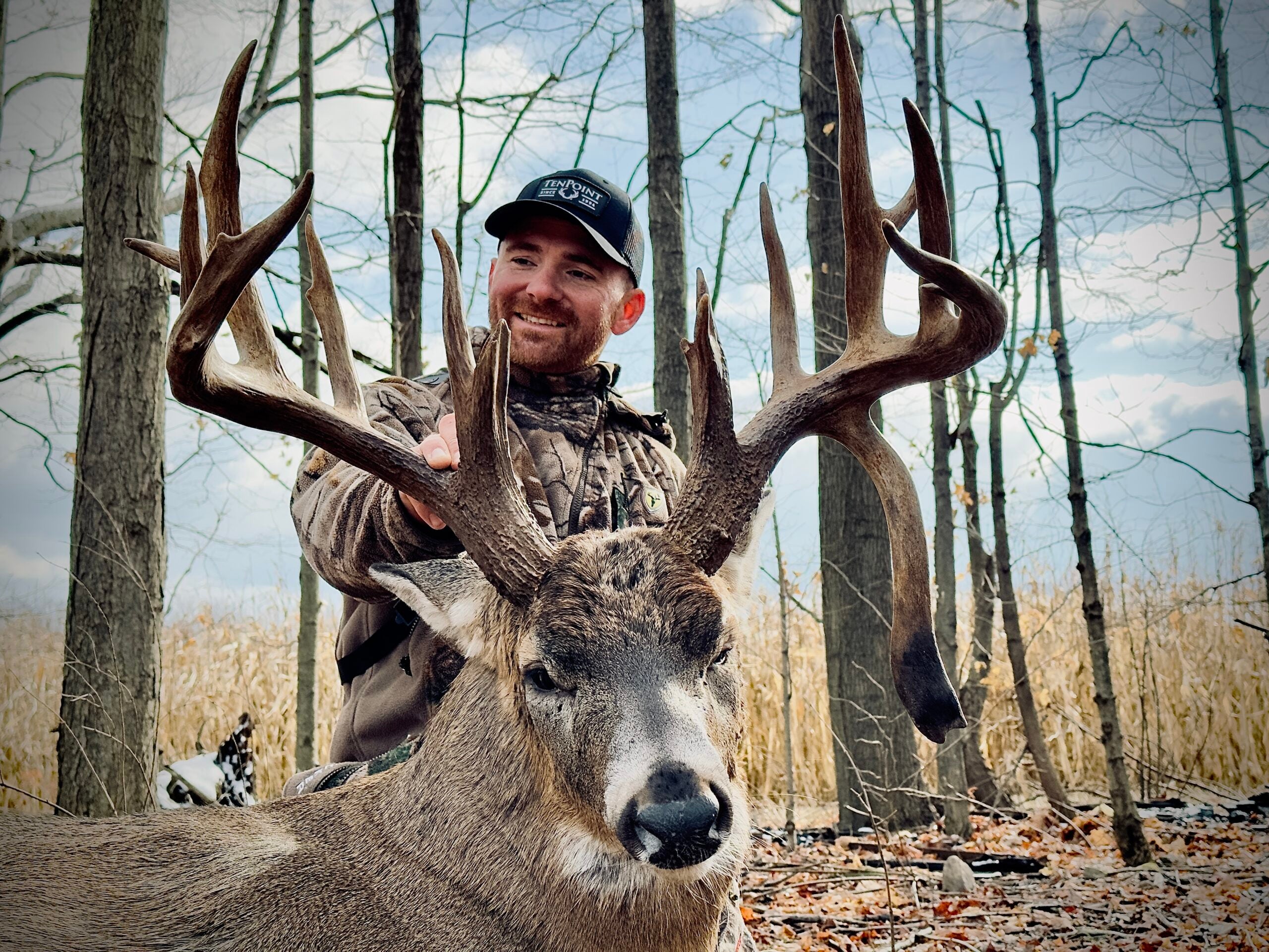 photo of hunter and big buck