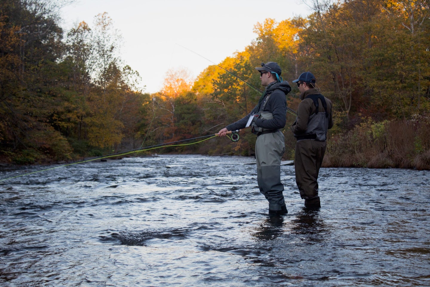 Two of the author's friends stand in Coho Hole at the upper section of the DSR as they wait to come tight with a steelhead.
