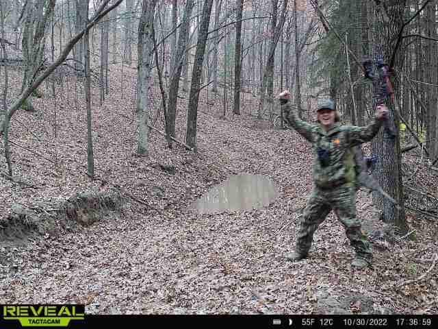 hunter celebrates in woods