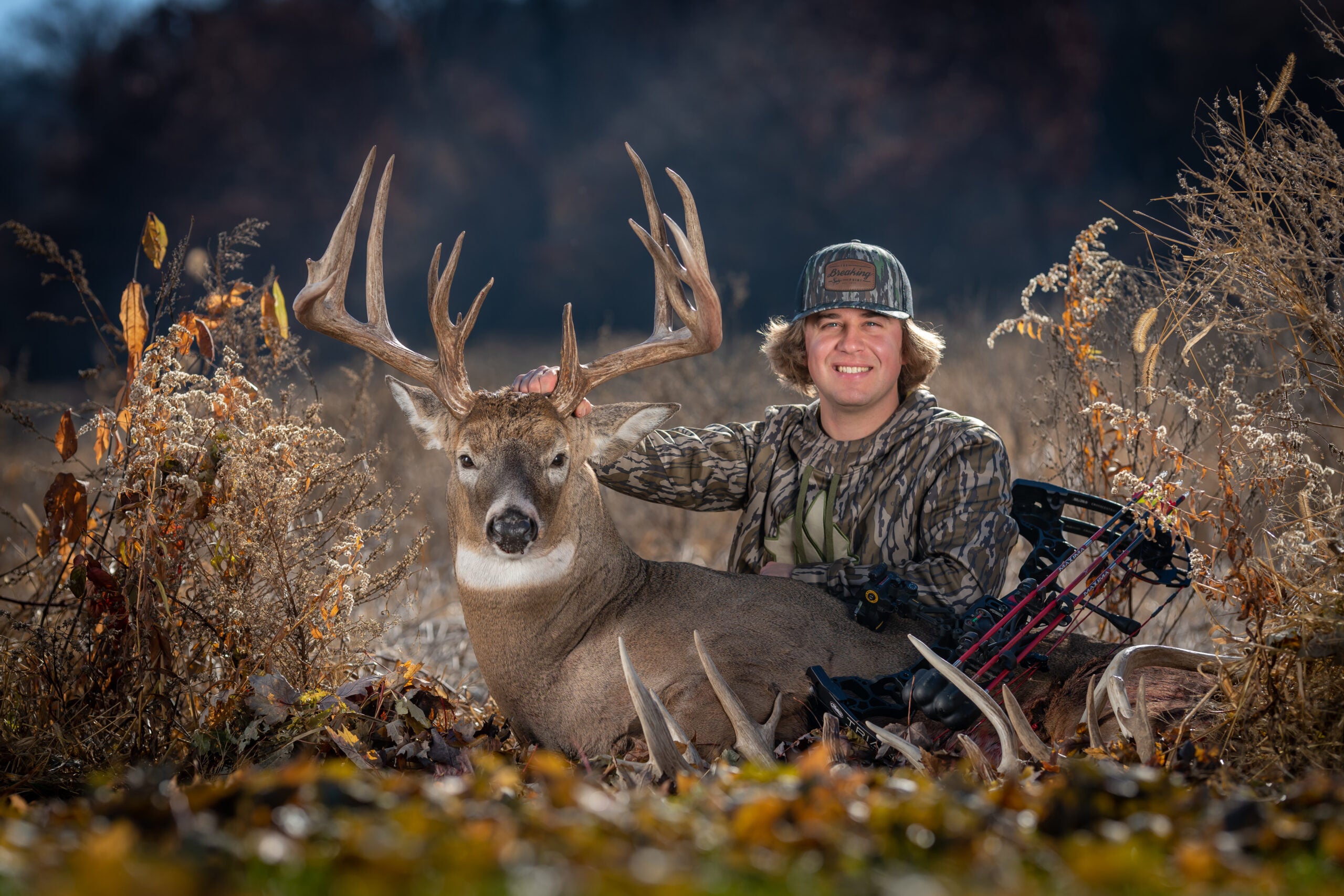 hunter poses with big bucks