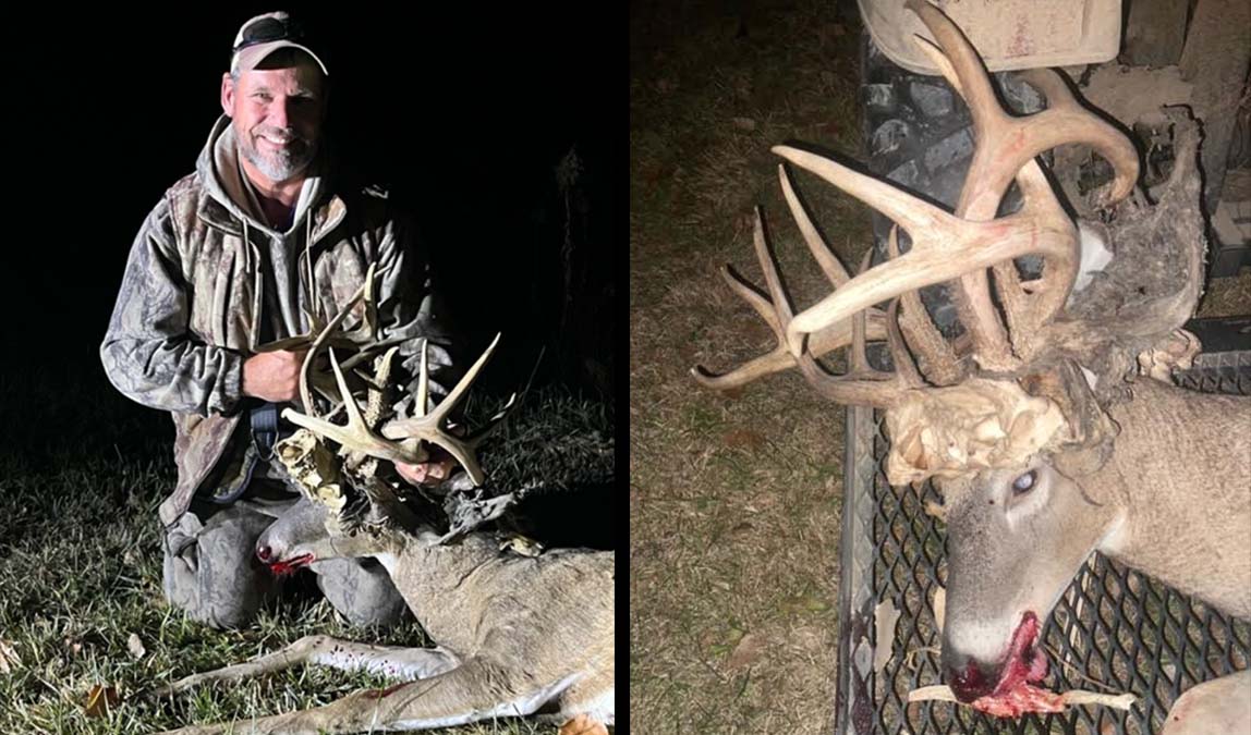 man poses with dead buck with antlers stuck to its antlers