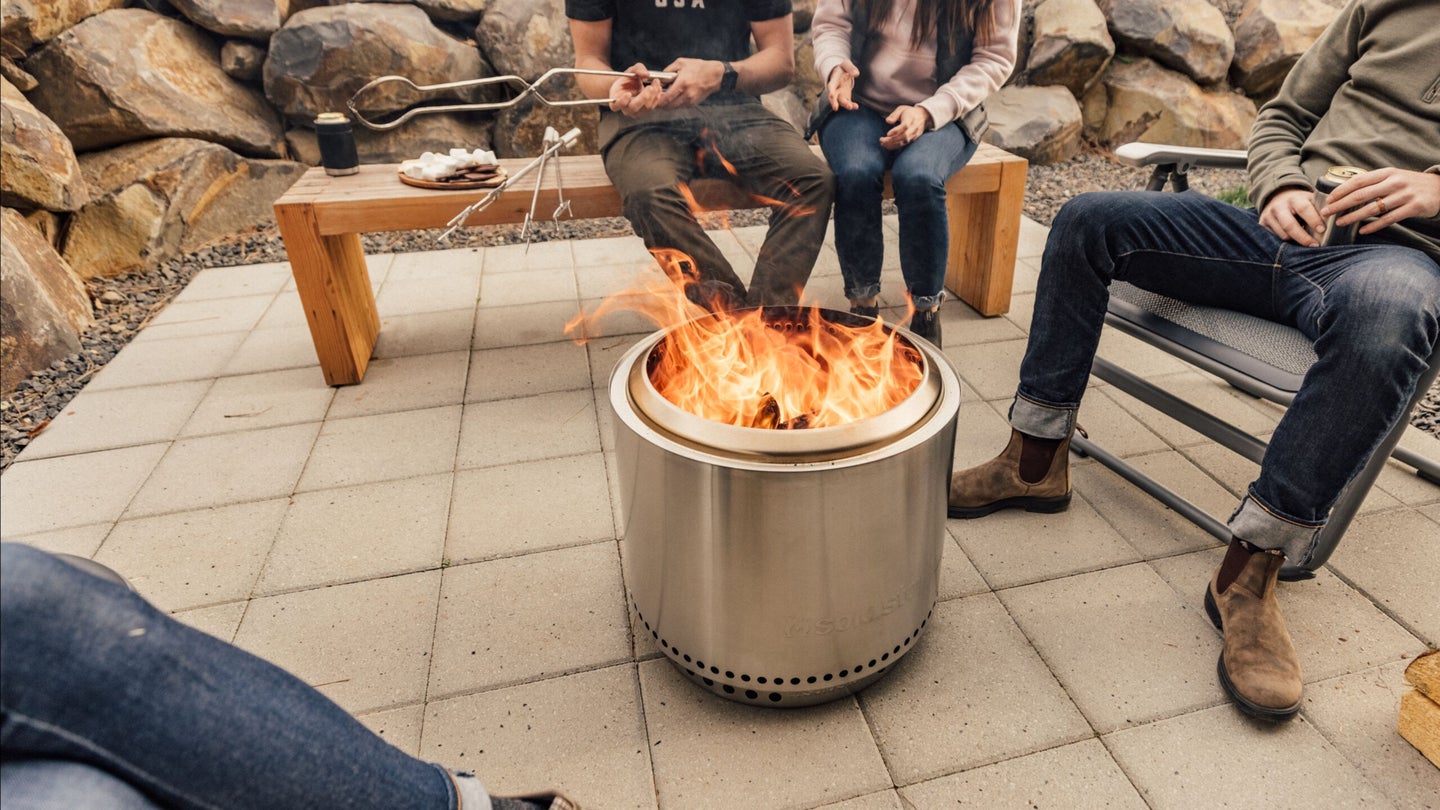 People sitting around a SoloStove fire pit