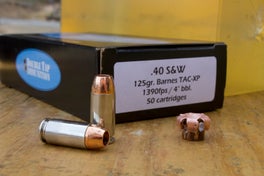 Doubletap handgun hunting ammo on a table.