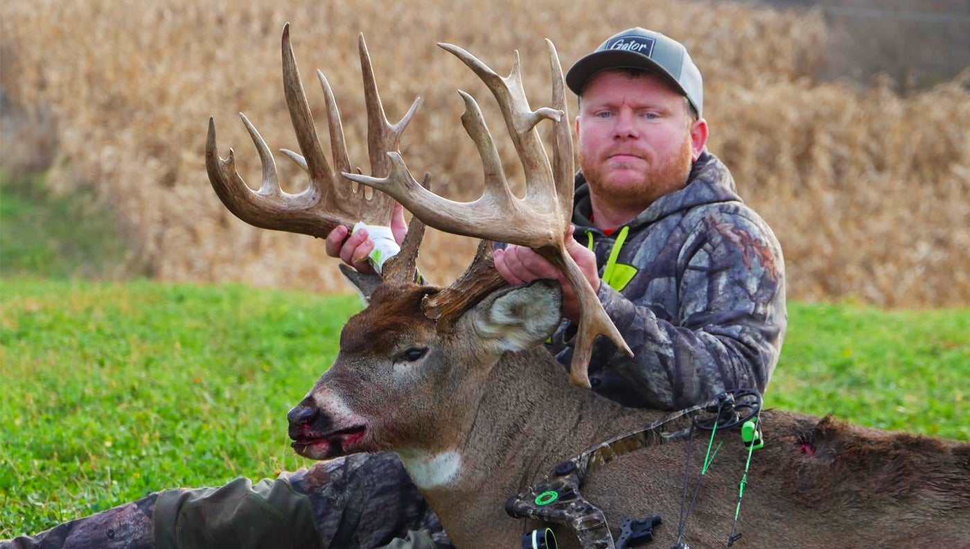 photo of hunter with huge buck