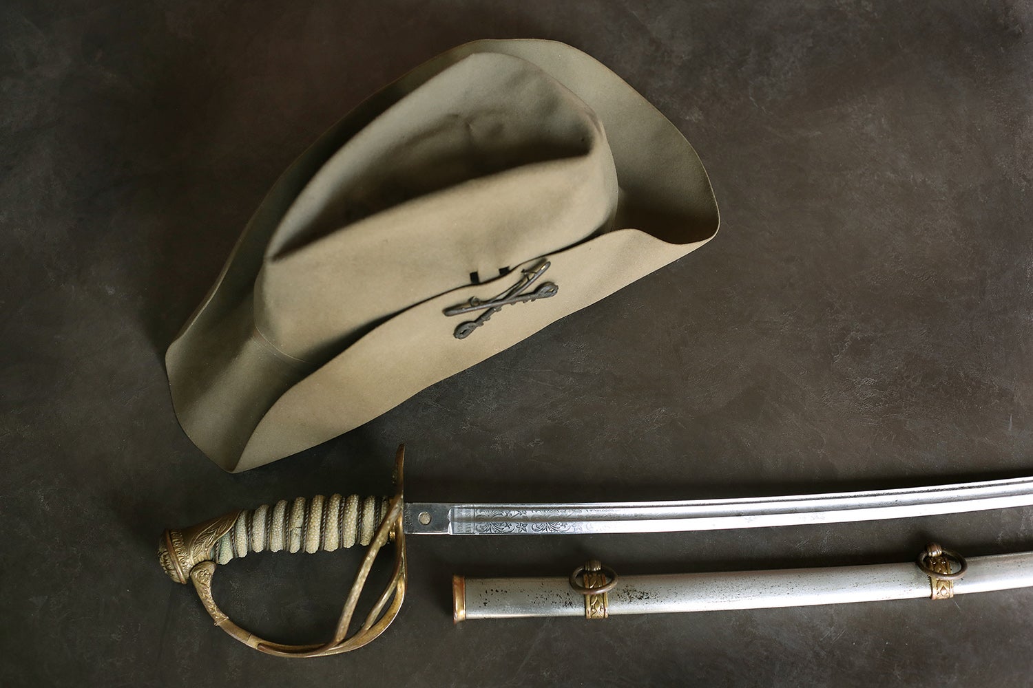 Roosevelt hat and saber from the Rough Riders.