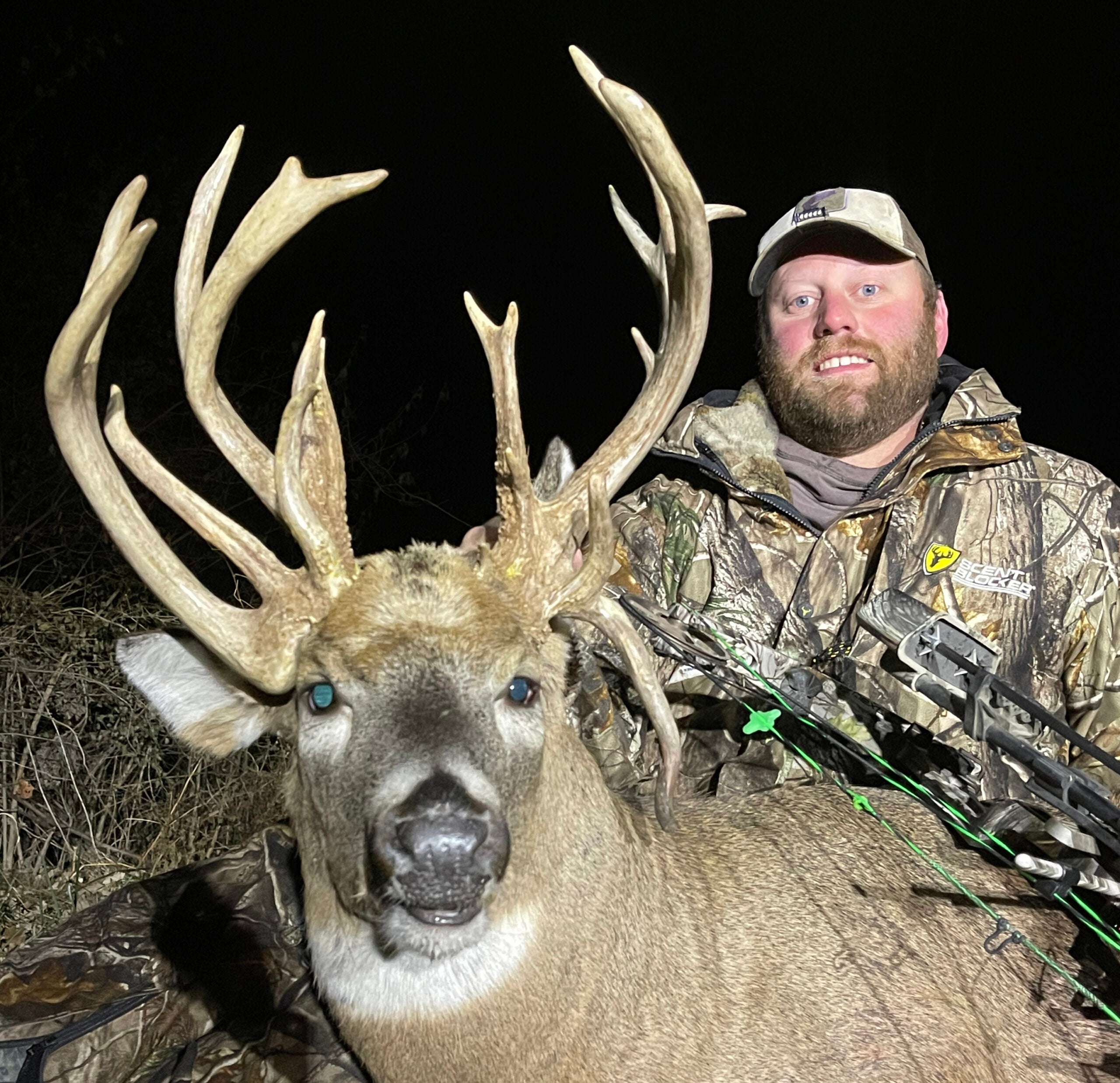 photo of hunter and big buck