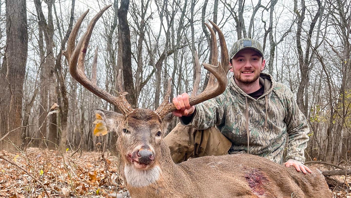 photo of hunter with big buck