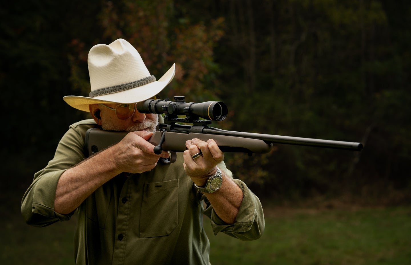Man wearing cowboy had shooting Mauser M18 Rifle.