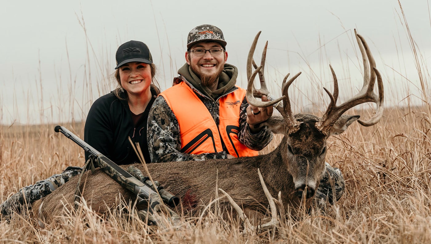 Aaron Linhart and his wife, Sarah, who filmed the hunt, pose with the big Iowa nontypical.